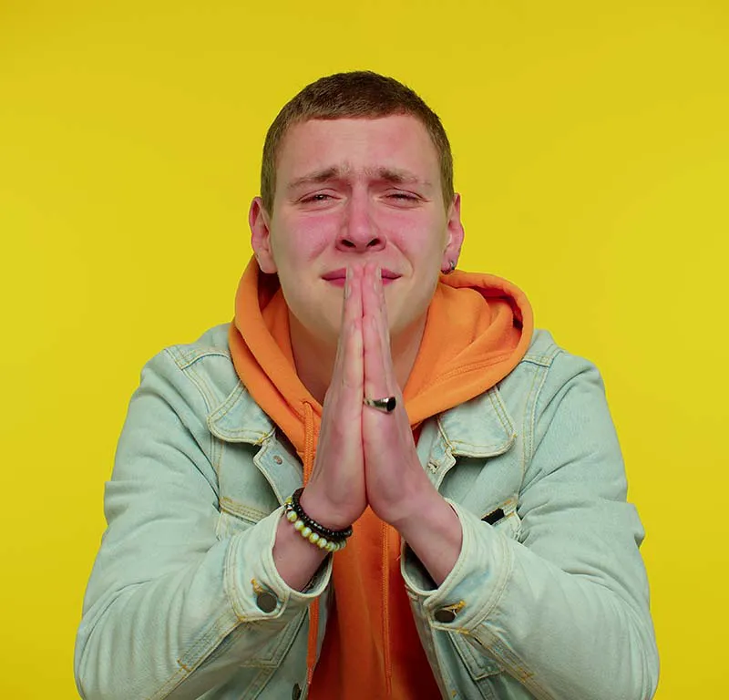 young man begging for forgiveness
