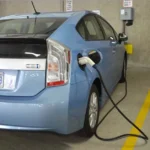 EV auto plugged into garage wall