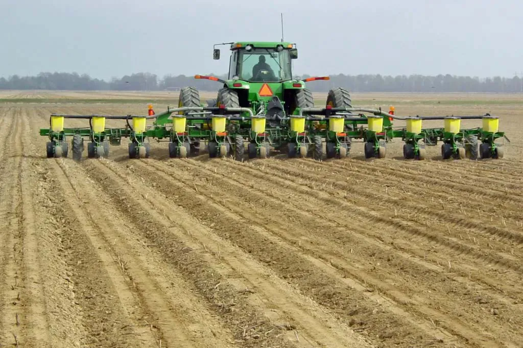 large tractor planting corn