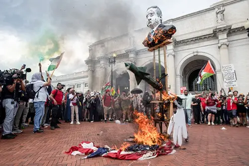 crowd burning american flag